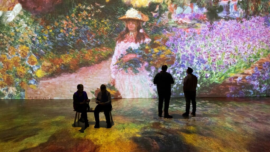 A group of people at the Beyond Monet exhibit
